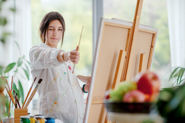 Creative artist painting on canvas