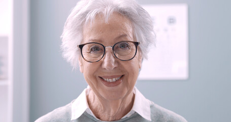 Smiling senior woman wearing glasses