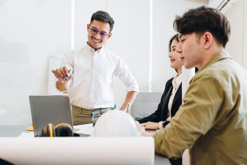 Fototapeta premium Engineers, designers and interior designers are finalizing the design of interiors by discussing selecting materials and colors to design rooms to present to clients.