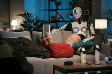 Senior man and android robot reading a book together