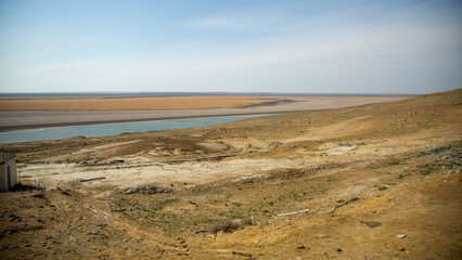 Fototapeta na wymiar dry land and a lake in desert
