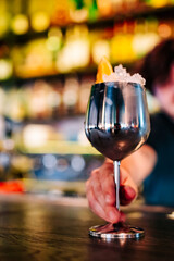 man hand bartender making cocktail in glass on the bar counter