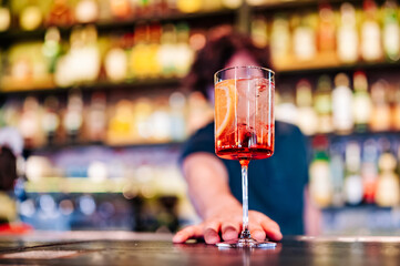 man hand bartender making cocktail in glass on the bar counter