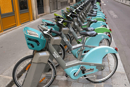 Paris, France. October 26, 2022: A row of electric bikes for self service rental in the street. Velib bike station. 