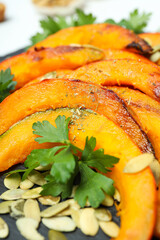 Concept of tasty homemade dish - baked pumpkin