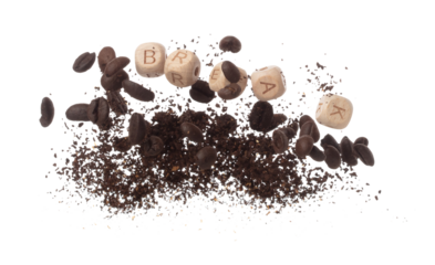 Rich aroma freshly roasted coffee beans fly in air as dance alongside alphabet letter blocks toy beads "BREAK", embodying essence of the coffee seed powder. White background isolated explosion