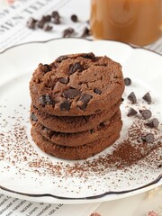 Cocoa brownies sprinkled with cocoa powder on a white tabletop