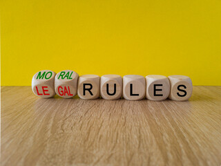 Legal or moral rules symbol. Turned wooden cubes and changes words 'legal rules' to 'moral rules'...