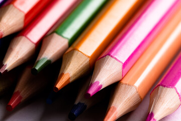 Close up of multi coloured pencils and copy space on white background