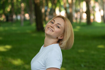 Portrait of a young beautiful girl walking in the park