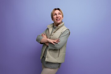 attractive blonde millennial woman in spring casual look on studio background with copy space