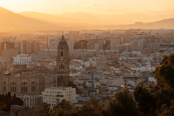 Fototapeta premium panoramic view of ancient spanish city Malaga, sunset, Andalusia, Spain