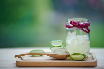 fresh aloe vera leaves and aloe vera gel in glass