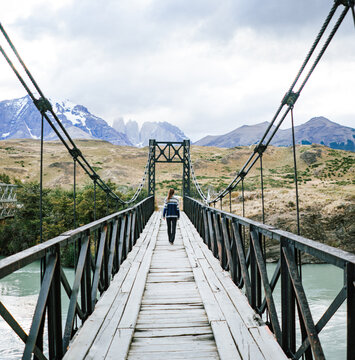 woman on bringe with mountains 
