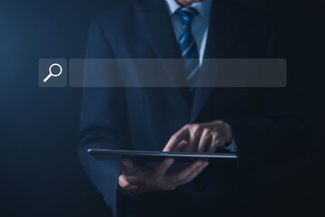 Businessman showing internet search in laptop	
