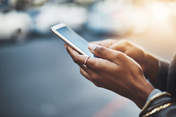 Woman, hands and phone in city for communication, social media or texting on street sidewalk outdoors. Hand of female chatting on mobile smartphone for networking, online browsing or travel in town