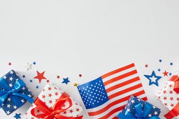 Fototapeta na wymiar Happy 4th of July celebration. Top view flat lay of gift boxes in national colors, american flag, patriotic stars on white background with blank space for text or ad