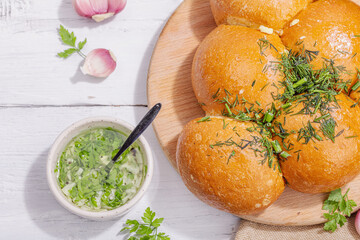 Aromatic garlic buns. Fresh baked goods, a traditional gluten-free soup snack. Parsley, spices