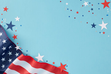 Creating a memorable party theme for American Independence Day. Top view flat lay of american flag and star-shaped confetti on pastel blue background with empty space for text or promotion