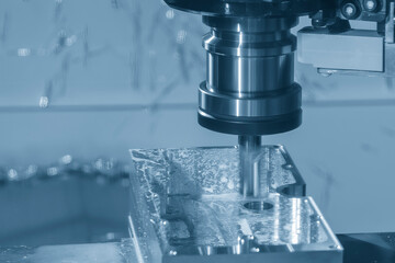 The CNC milling machine rough cutting the aluminum housing with flat end mill tool.