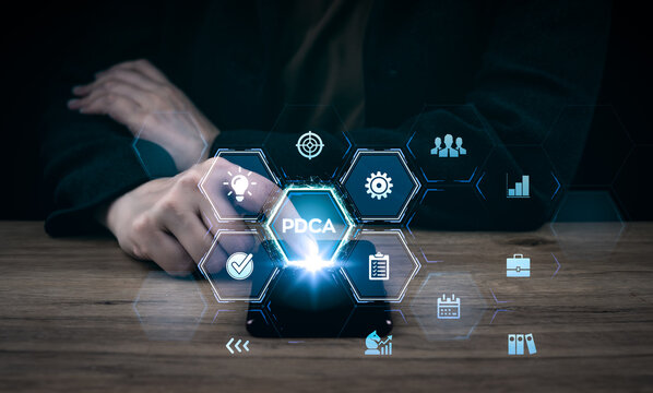 PDCA Plan Do Check Act. Business technology concept. Technology, Internet and network. Business man use mobile phone to manage on virtual screen. Hand touching digital interface.