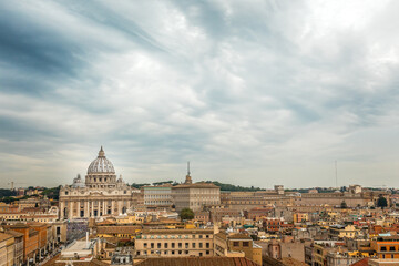 Fototapeta na wymiar View over the roof tops of Rome to Saint Peters Cathedral