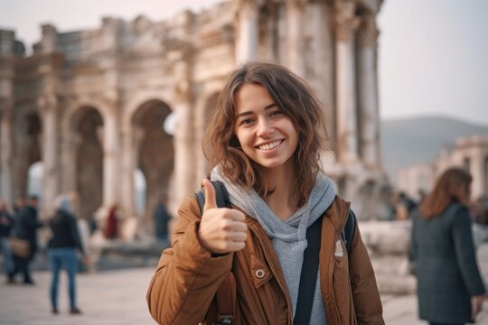 Medium shot portrait photography of a glad girl in her 30s with thumbs up against a historical monument background. With generative AI technology