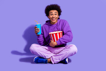 Full size photo of impressed funny person wear stylish pullover hold popcorn basket cup of soda...