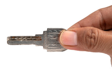 Old door lock in male hand isolated on white background. Macro shot