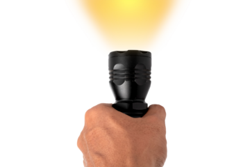 Black LED flashlight in male hand isolated on white background