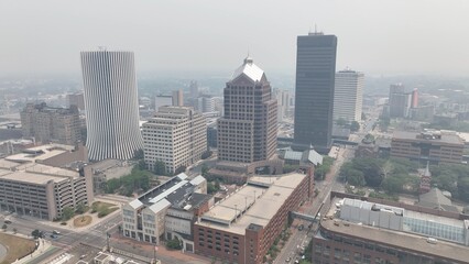 Downtown Rochester NY in dense smoke from Canadian wildfires blowing over city skyline caused by climate change