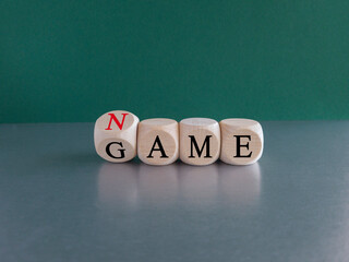 Name of the game symbol. Wooden cubes with concept words Name Game. . Beautiful green background. Business and name of the game concept. Copy space.