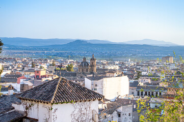 Walking in historic center in Granada, Spain on April 5, 2023 - obrazy, fototapety, plakaty