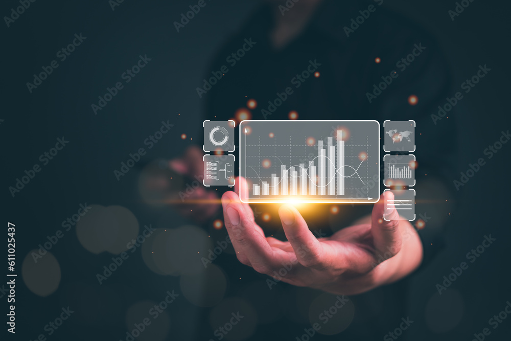 Poster businessman or analyst working with business analytics and data management system on virtual screen,