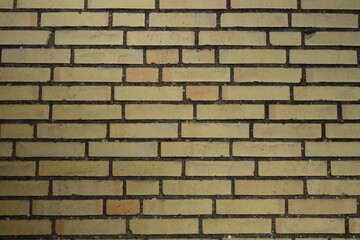 Brick wall with different shades of yellow 