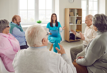 Group of happy senior people, old male female retirement home patients and young nurse carer...