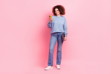 Full length photo of cute charming lady wear blue sweatshirt typing twitter telegram facebook isolated pink color background