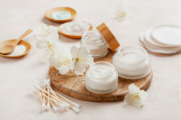 Obraz na płótnie Canvas skincare products and jasmine flowers. zero waste eco friendly natural cosmetics for home spa