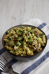 Homemade Chicken Spinach Alfredo Rotini Pasta in a Bowl, side view.