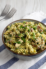 Homemade Chicken Spinach Alfredo Rotini Pasta in a Bowl, side view.