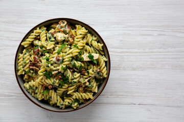 Homemade Chicken Spinach Alfredo Rotini Pasta in a Bowl, top view. Flat lay, overhead, from above.