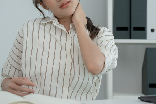 Office Syndromes, Woman Massaging Neck Pain Due To Work And Using A Computer, Digital Composite Of A Focused Spine Of Neck Pain And Shoulder Pain Symptoms , Injuries, Health Care, Medical, Myositis.