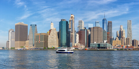 Fototapeta na wymiar New York City skyline of Manhattan with World Trade Center skyscraper and ferry panorama in the United States