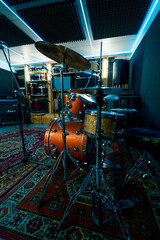 empty professional recording studio with musical instruments drums speakers rack with microphone neon light