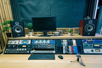 A recording studio control panel mixer with an equalizer faders buttons for broadcasting a...