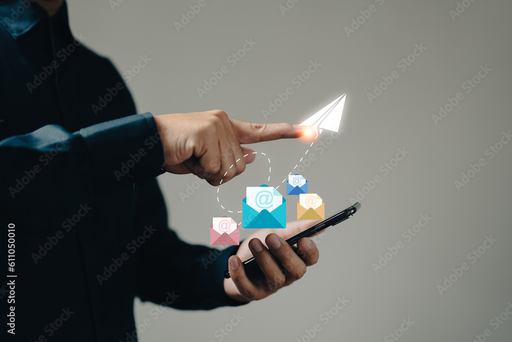 Poster the businessman hand holds a phone icon as it appears on the screen, representing the concept of ema