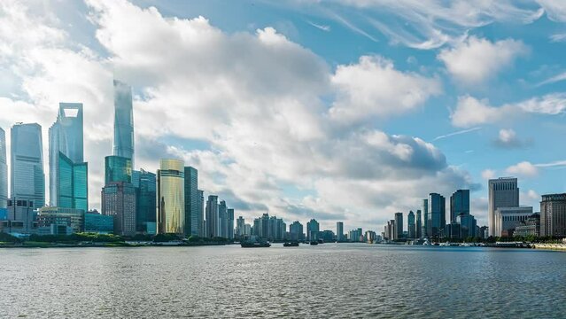 Time-lapse of city buildings and river and cloudscape in Shanghai