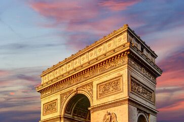 Arc de Triomphe (against the background of sky with clouds), Paris, France. The walls of the arch...