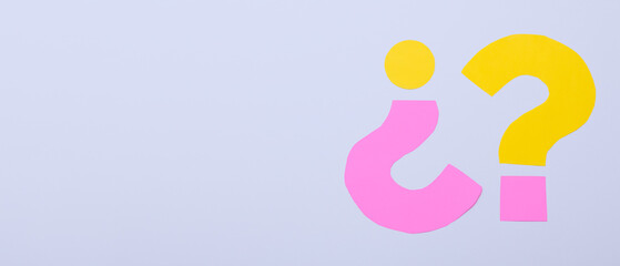 Question marks on grey background with space for text
