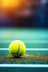 a tennis ball on a tennis court. the concept of sports, competitions and a healthy lifestyle. Generative AI